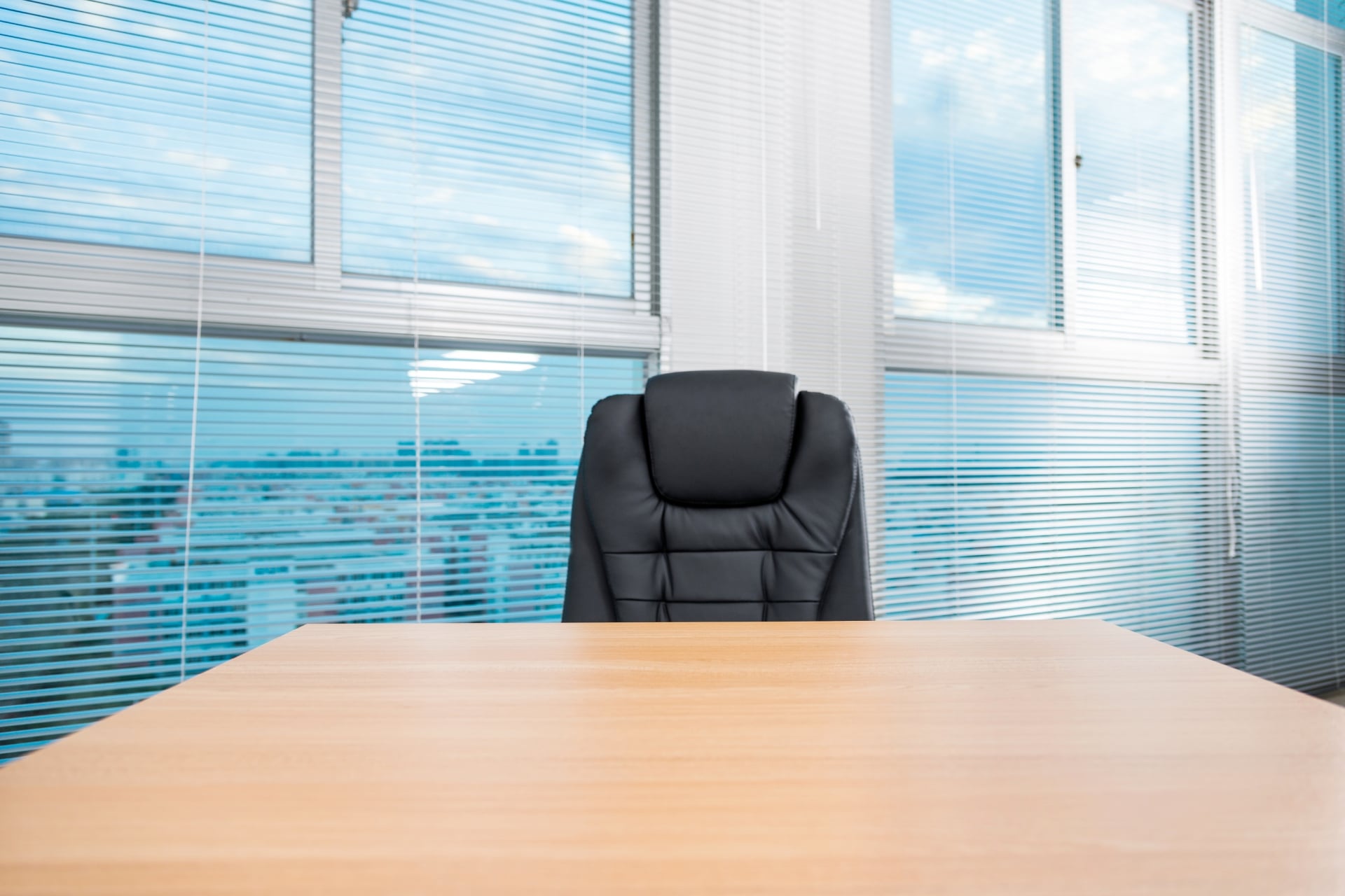 Office table and chair and venetian blinds